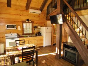 A kitchen or kitchenette at Freedom Ridge Cabins