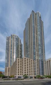 a group of tall buildings in a city at Global Luxury Suites Downtown Jersey City in Jersey City