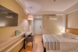 Cama ou camas em um quarto em Viale Cataratas Hotel & Eventos