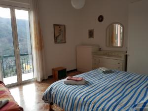 Un pat sau paturi într-o cameră la Villa delle Rose