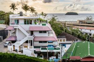 an aerial view of a building with the ocean in the background at Hotel Kata Hill Sea View in Kata Beach