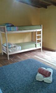 Postel nebo postele na pokoji v ubytování Yateí-house