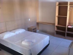 En eller flere senger på et rom på Pousada Veraneio Ponta Negra