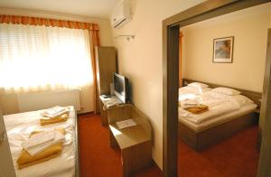 Voodi või voodid majutusasutuse Hotel Bavaria toas