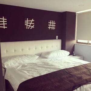 Postel nebo postele na pokoji v ubytování Hotel Garden City Boutique