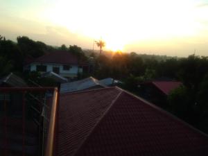 a view of the sunset from the roof of a house at Jem Jeff Residence Inn in Cabugao Norte