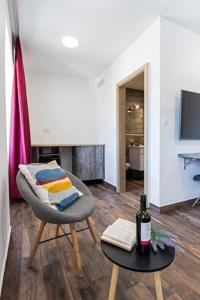 TV/Unterhaltungsangebot in der Unterkunft Apinelo Port Rooms