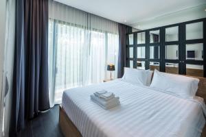 Ένα ή περισσότερα κρεβάτια σε δωμάτιο στο The Infinity Private Pool Villa