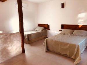 Postel nebo postele na pokoji v ubytování Sina Residencial