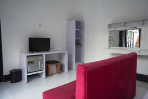 TV a/nebo společenská místnost v ubytování Vande Guest House
