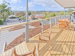 a deck with two chairs and a table on a house at Hahndorf Haven-Central Hahndorf in Hahndorf