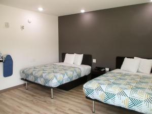 Ένα ή περισσότερα κρεβάτια σε δωμάτιο στο Studio 6-Port Allen, LA - Baton Rouge I-10 +39 φωτογραφίες