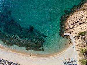 an aerial view of a beach and the ocean at Green Bay in Limenaria