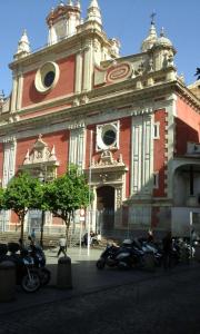a large building with motorcycles parked in front of it at Apartment Villegas in Seville
