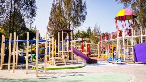 a playground with colorful slides and slidesktop at Sabda Alam Hotel & Resort in Garut