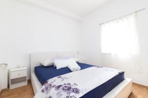 Posteľ alebo postele v izbe v ubytovaní Kuća Ella