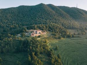 an aerial view of a house on a mountain at Mas el Mir in Ripoll