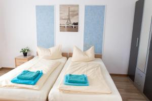 Cama o camas de una habitación en Pension Nuernberg-Fuerth