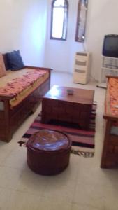 a living room with a couch and a coffee table at Dar el Baraka in Bizerte