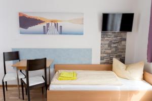 เตียงในห้องที่ Central Apartments Nürnberg-Fürth