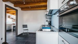 a kitchen with a sink and a counter top at Residence Primavera in Bellano