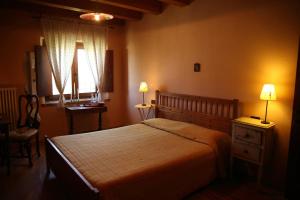 Postel nebo postele na pokoji v ubytování Agriturismo Corte Pellegrini