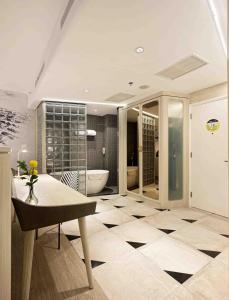a white bathroom with a white toilet and sink at YELLO Hotel Harmoni in Jakarta