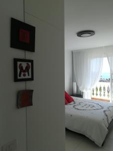 Łóżko lub łóżka w pokoju w obiekcie Parque Tropical I