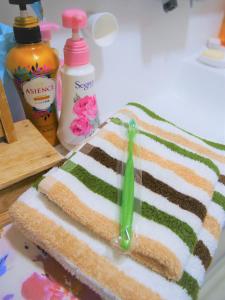 a close up of a sandwich with a toothbrush on it at Minpaku Mon in Sapporo