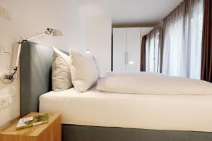 Letto o letti in una camera di Maximilians Domizil Edenkoben