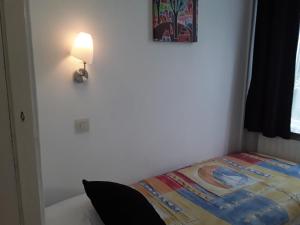 Postel nebo postele na pokoji v ubytování Hotel Baan