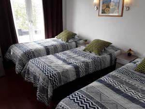 Postel nebo postele na pokoji v ubytování Hotel Baan