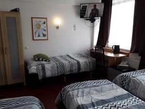 Postel nebo postele na pokoji v ubytování Hotel Baan