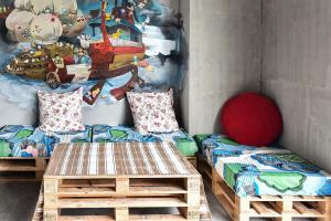 Una cama o camas en una habitación de Anping Wikid Design Hotel