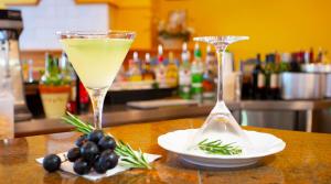 a drink in a martini glass sitting on a table at Country Hotel Timmendorfer Strand in Timmendorfer Strand