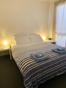 Postel nebo postele na pokoji v ubytování Bayview Beach House Apartment No 1