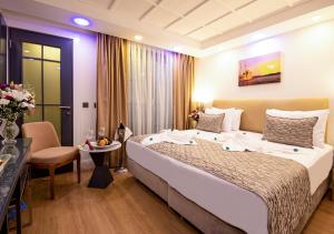 Postel nebo postele na pokoji v ubytování Antusa Design Hotel & Spa