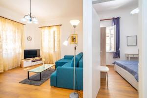 Televízia a/alebo spoločenská miestnosť v ubytovaní History Apartments Center