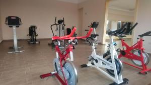 a group of exercise bikes in a gym at L'AUBERGE DE TENNIS MSC in Marrakech