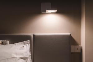 a refrigerator with a light on top of it at Sicilia's Art Hotel & Spa in Acitrezza