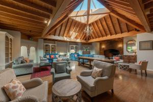 a large living room with a large wooden ceiling at Careys Manor Hotel & SenSpa in Brockenhurst