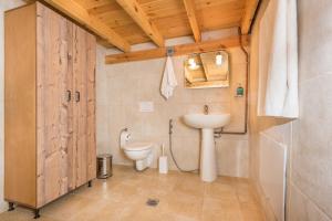 a bathroom with a toilet and a sink at ARADENA TRADITIONAL House 3 in Arádhaina