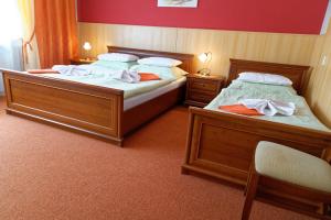 Postel nebo postele na pokoji v ubytování Hotel KAMU GARNI