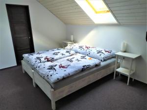 Postel nebo postele na pokoji v ubytování Statek Český Dvůr