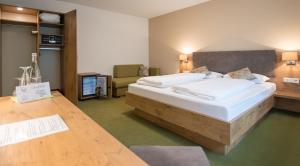 Postel nebo postele na pokoji v ubytování Gasthaus Hotel Kranz