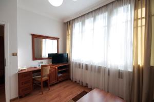 TV o dispositivi per l'intrattenimento presso Art Deco Hotel Hoffmann