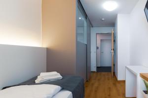 Postel nebo postele na pokoji v ubytování mk hotel münchen max-weber-platz