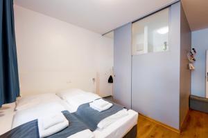 Postel nebo postele na pokoji v ubytování mk hotel münchen max-weber-platz