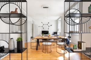 a dining room with a table and chairs at ALTIDO Downtown Bliss Apartments in Lisbon