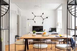 a dining room with a table and chairs at ALTIDO Downtown Bliss Apartments in Lisbon